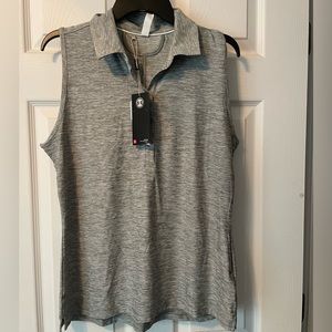 NWT women’s Under Armor heat gear golf or tennis shirt. Size Large.